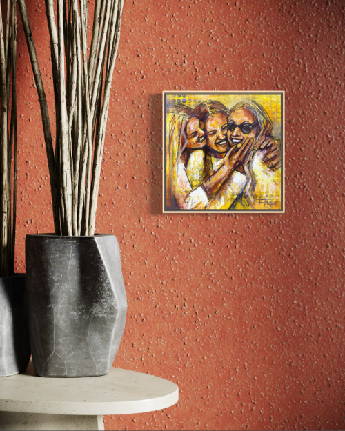 Framed artwork of a couple embracing on a textured red wall with decorative elements.