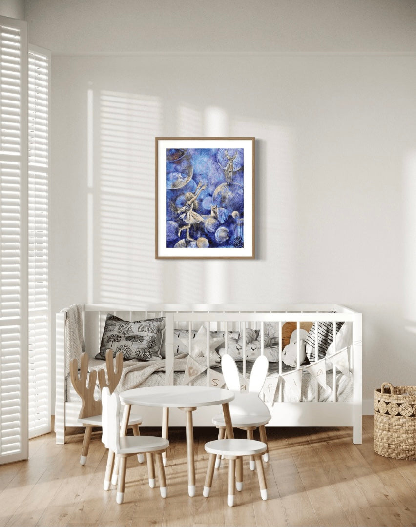 A painting titled 'Chasing Dreams' hanging on a wall over a white table and chairs, featuring a whimsical scene with a girl, a deer, and a fox.