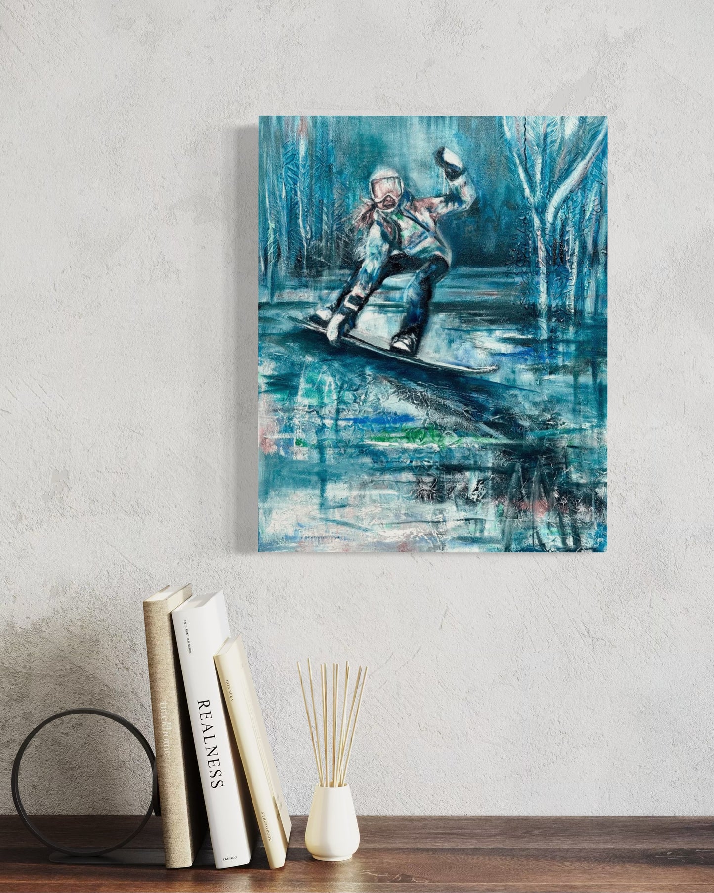 A canvas painting depicting an abstract winter landscape with a snowboarder.