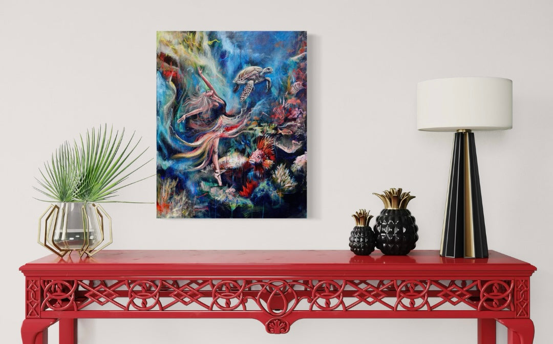Abstract painting of a girl dancing underwater, above a red bench with decorative lamp and plant.