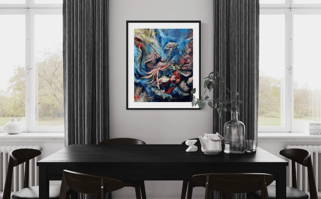 A modern Dining setting showing a framing option for the painting Journey Through the Depths a colourful underwater abstract painting of a dancer.