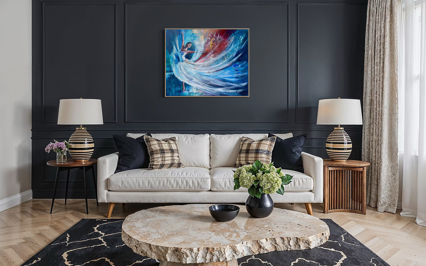 Living room with a white sofa, round stone coffee table, and an abstract dancer painting on a dark wall.